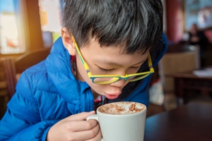 boy drinking hot cocoa chocolate